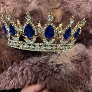 White Sash with Gold 'Prom Queen' Lettering as well as blue gem crown